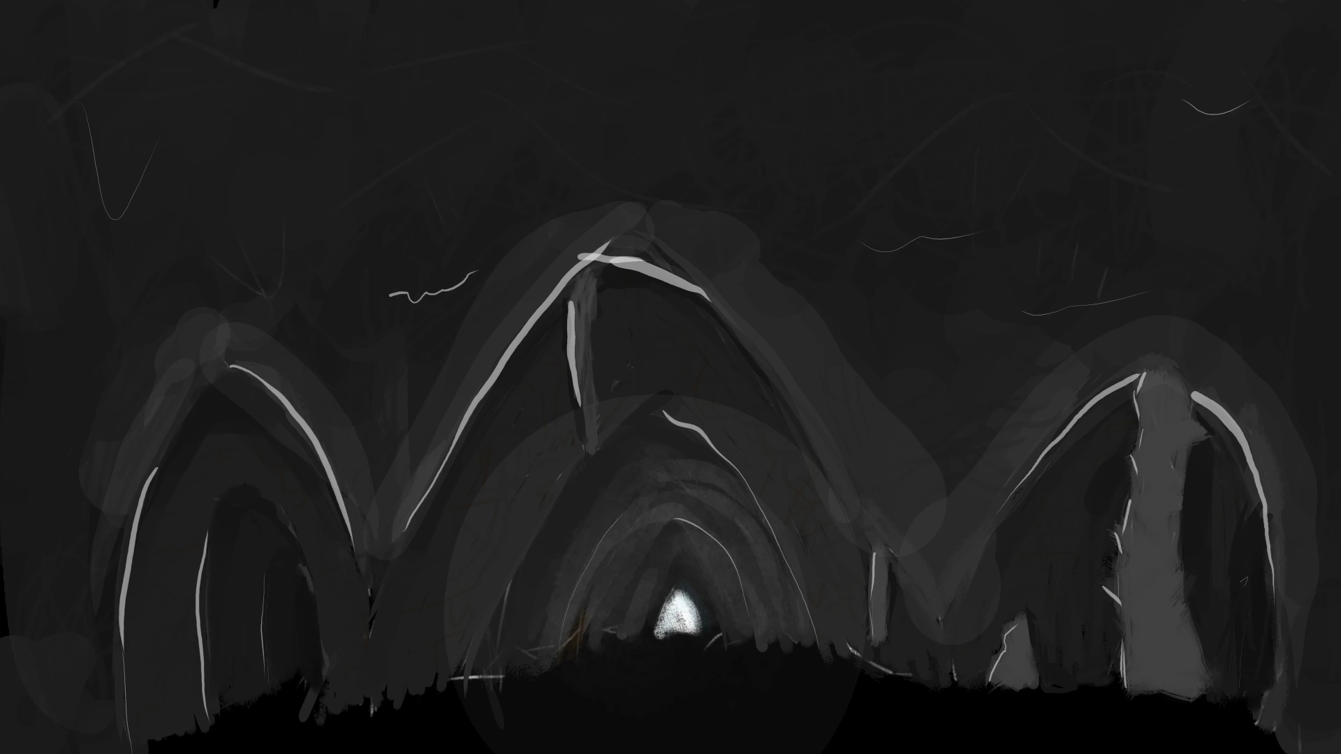 cave entrance with three paths and light at the end of the middle one